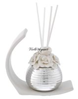 Ribbed rose perfumer with stylized arch base