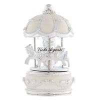 White carousel horses with light