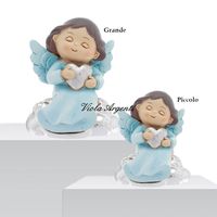 Seated blue heart angel
