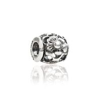 Perforated flower corolla charm