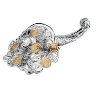 Cornucopia sculpture with coins