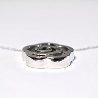 Collana con fiore stilizzato in oro bianco 18kt