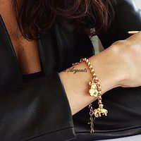 Bracciale ciondoli oro giallo 750