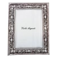 Wrought silver mirror